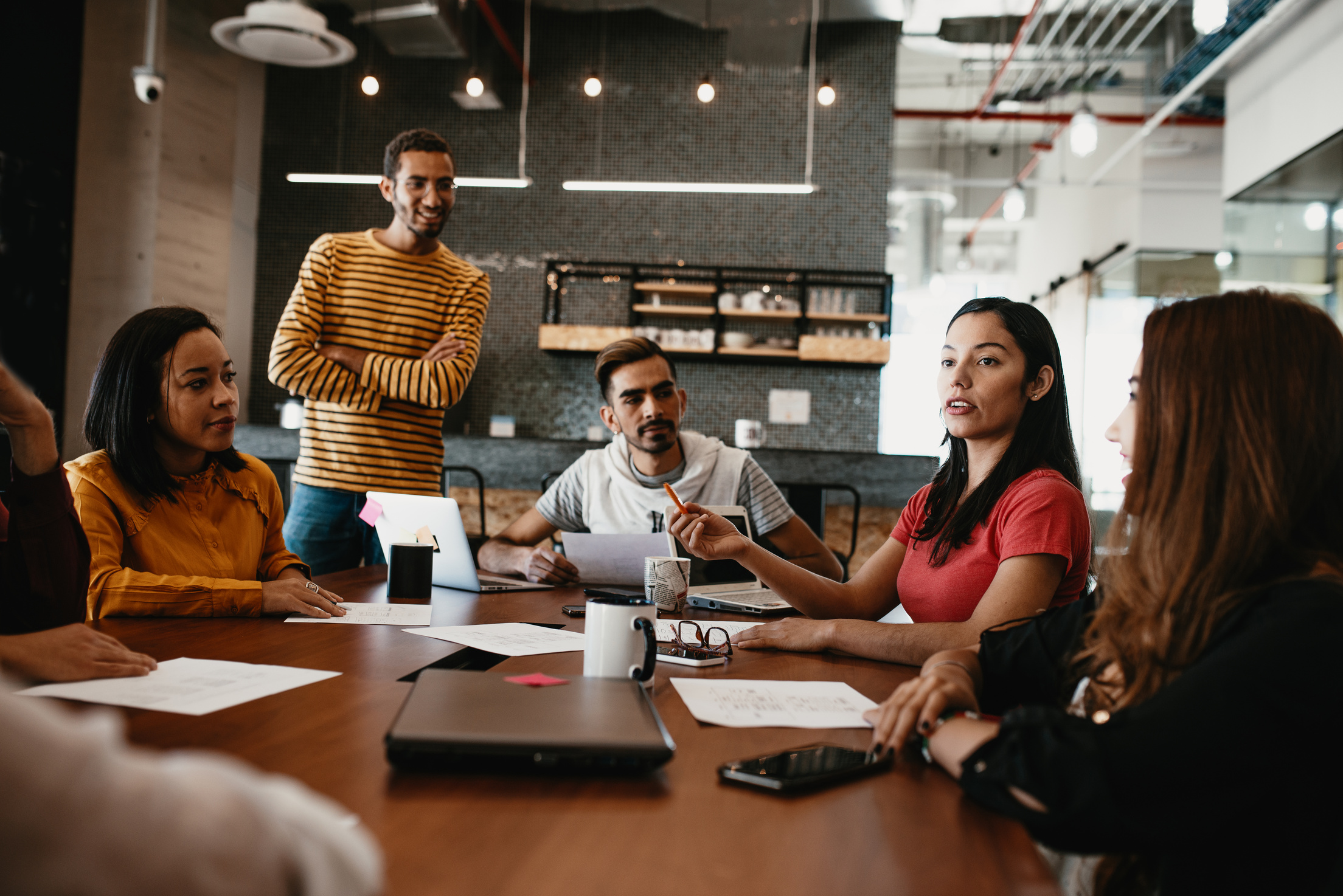 Determined Latina woman in office on business meeting